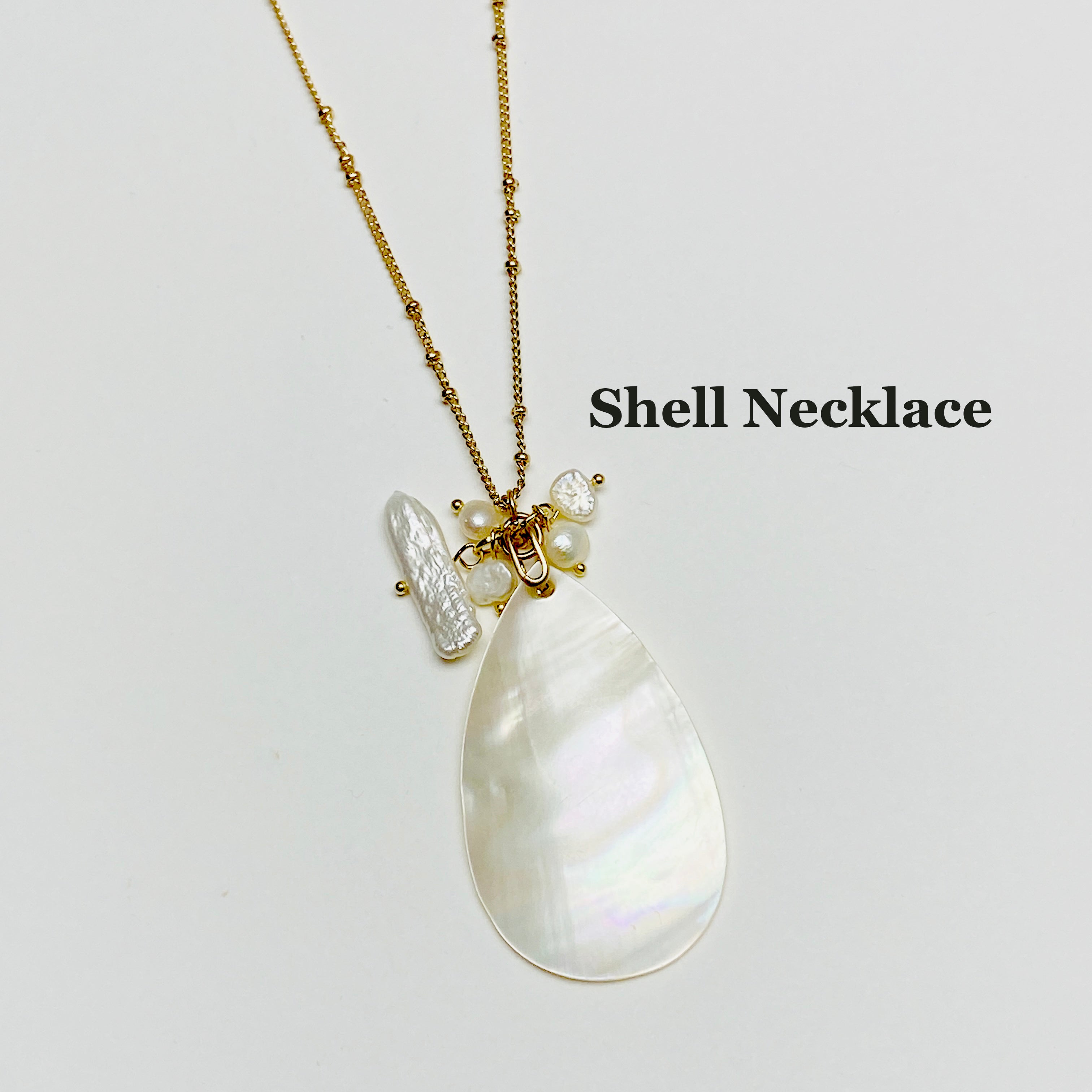 Round White Shell Pendant With Black Cord
